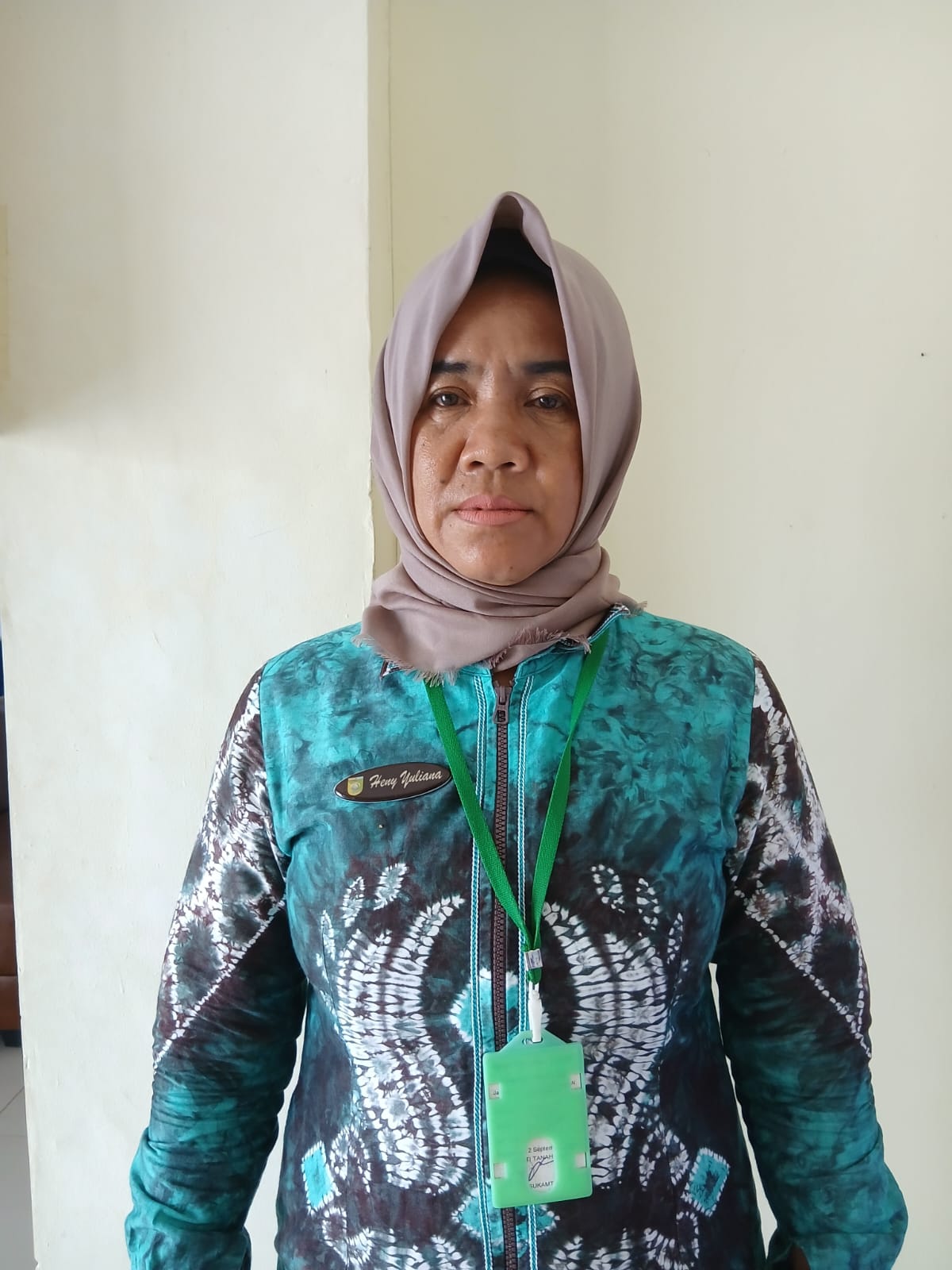 Hj. HENNY YULIANA, S.Sos